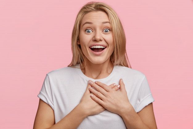 Free_Photo___Portrait_of_attractive_overjoyed_young_woman_recieves_unexpecte.jpg